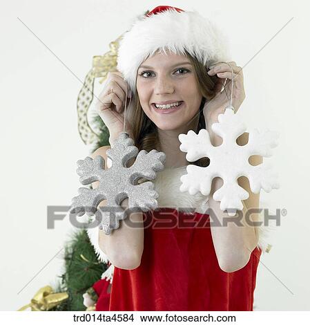 A woman wearing Santa Claus' clothes View Large Photo Image Picture - A woman wearing Santa Claus' clothes. Fotosearch