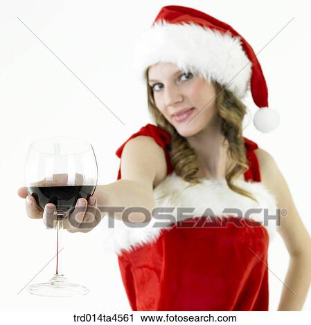 A woman wearing Santa Claus' clothes and holding a wine glass View Large Photo Image Stock Image - A woman wearing Santa Claus' clothes and holding a wine glass. Fotosearch