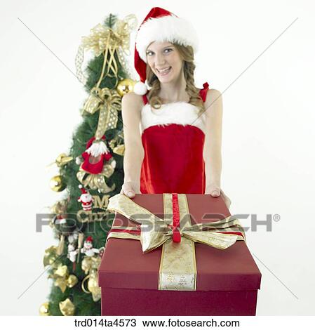 a woman wearing Santa Claus' clothes and giving gifts View Large Photo Image Stock Image - a woman wearing Santa Claus' clothes and giving gifts. Fotosearch