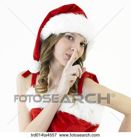 Stock Photo - A woman wearing Santa Claus' clothes. Fotosearch