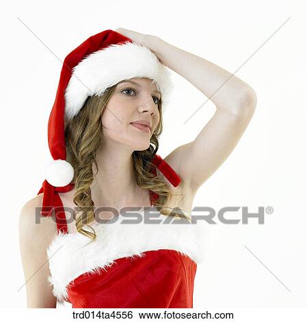 Stock Photograph - A woman wearing Santa Claus' clothes. Fotosearch