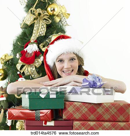 a woman wearing Santa Claus' clothes and giving gifts View Large Photo Image Stock Photograph - a woman wearing Santa Claus' clothes and giving gifts. Fotosearch
