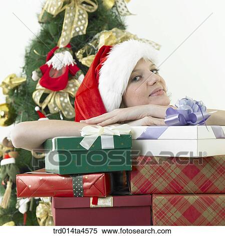 a woman wearing Santa Claus' clothes and giving gifts View Large Photo Image Stock Photography - a woman wearing Santa Claus' clothes and giving gifts. Fotosearch
