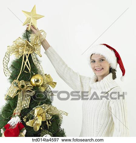 A woman wearing Santa Claus' hat View Large Photo Image Stock Photo - A woman wearing Santa Claus' hat. Fotosearch
