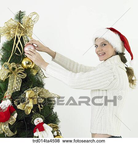 A woman wearing Santa Claus' hat View Large Photo Image Stock Photo - A woman wearing Santa Claus' hat. Fotosearch