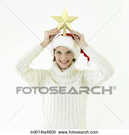 A woman wearing Santa Claus' hat View Large Photo Image Stock Photography - A woman wearing Santa Claus' hat. Fotosearch