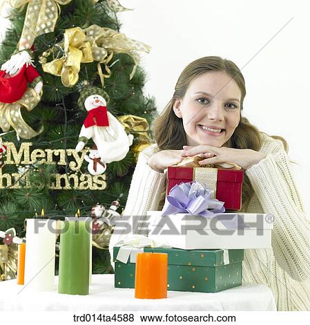 A woman with Christmas decoration and Gift View Large Photo Image Stock Photo - A woman with Christmas decoration and Gift. Fotosearch