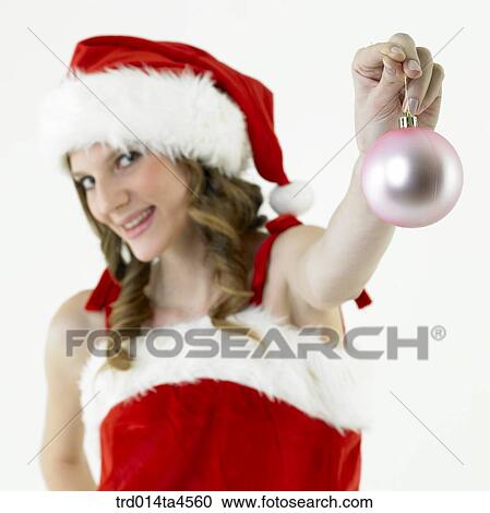 Christmas decoration and a woman wearing Santa Claus' clothes View Large Photo Image Stock Image - Christmas decoration and a woman wearing Santa Claus' clothes. Fotosearch