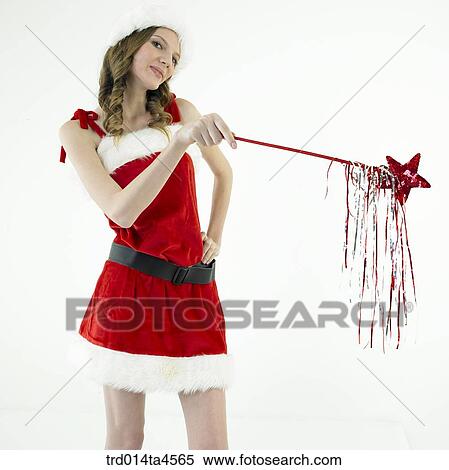 Christmas decoration and a woman wearing Santa Claus' clothes View Large Photo Image Stock Photography - Christmas decoration and a woman wearing Santa Claus' clothes. Fotosearch