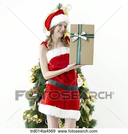 Christmas gift, a woman wearing Santa Claus' clothes View Large Photo Image Stock Photo - Christmas gift, a woman wearing Santa Claus' clothes. Fotosearch