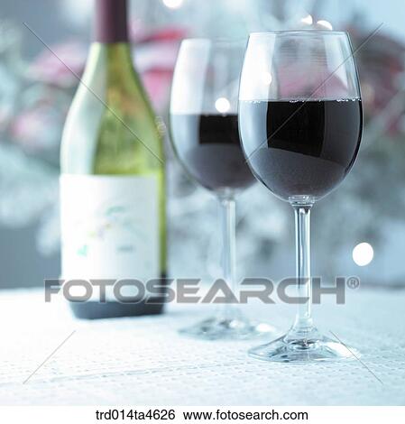 Stock Photograph - Wine and gift boxes at the Christmas party. Fotosearch