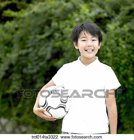 Stock Image - Boy having soccer ball. Fotosearch