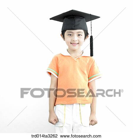 Boy reading books with graduation cap View Large Photo Image Stock Image - Boy reading books with graduation cap. Fotosearch