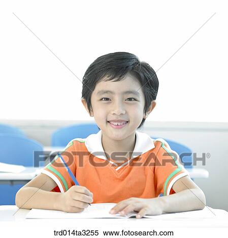 Boy taking notes View Large Photo Image Stock Photography - Boy taking notes. Fotosearch
