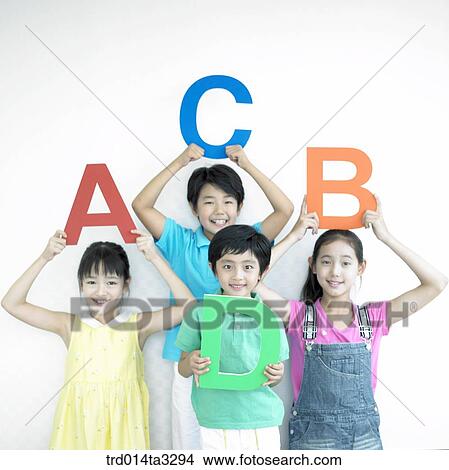 Children holdingt Alphabet letters View Large Photo Image Picture - Children holdingt Alphabet letters . Fotosearch