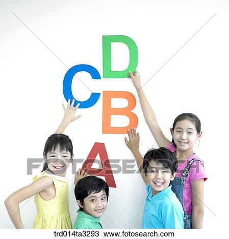 Stock Image - Children holdingt Alphabet letters . Fotosearch