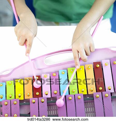 Children's hands playing Xylophone View Large Photo Image Stock Photograph - Children's hands playing Xylophone. Fotosearch