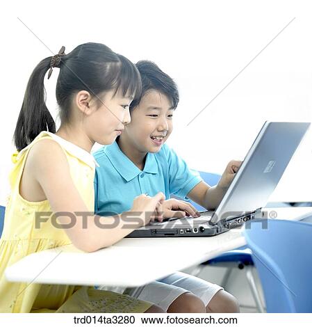 Chilgren looking at notebook computer View Large Photo Image Stock Image - Chilgren looking at notebook computer. Fotosearch