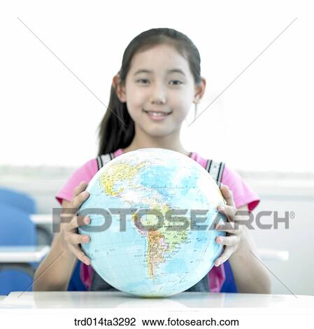 Girl holding golbe View Large Photo Image Stock Image - Girl holding golbe. Fotosearch