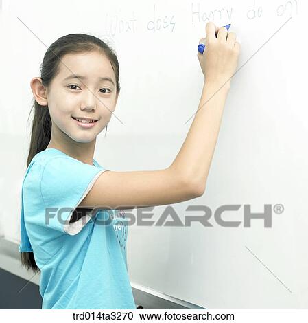 Girl writing an answer on board View Large Photo Image Stock Image - Girl writing an answer on board. Fotosearch