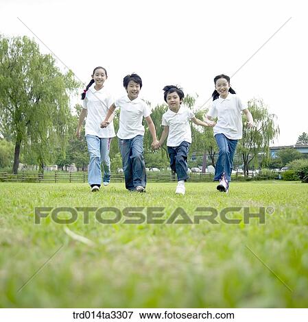 Stock Photo - Running children with holding hands. Fotosearch