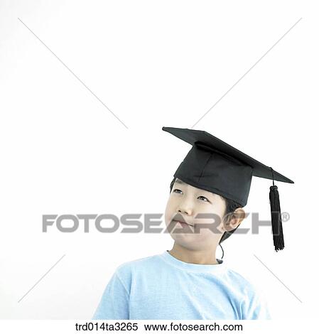 Thinking boy with graduation cap View Large Photo Image Stock Photography - Thinking boy with graduation cap. Fotosearch