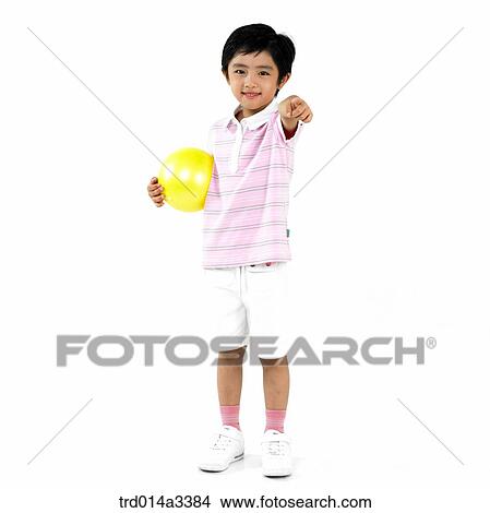 Boy holding ball View Large Photo Image Picture - Boy holding ball. Fotosearch