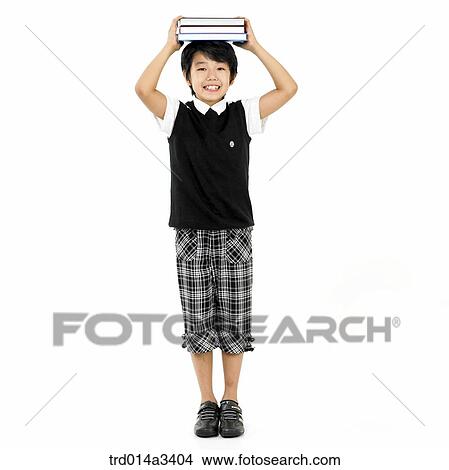 boy putting books on his head View Large Photo Image Picture - boy putting books on his head. Fotosearch