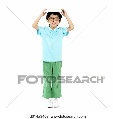 boy putting books on his head View Large Photo Image Stock Photo - boy putting books on his head. Fotosearch