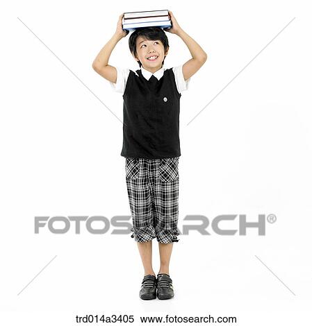 boy putting books on his head View Large Photo Image Stock Photography - boy putting books on his head. Fotosearch