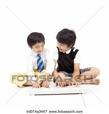 Boys using keyboard View Large Photo Image Stock Photo - Boys using keyboard. Fotosearch