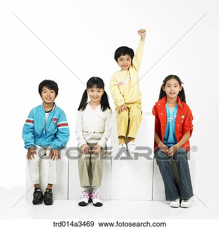 Child raising hands and his sitting friends View Large Photo Image Stock Photo - Child raising hands and his sitting friends. Fotosearch