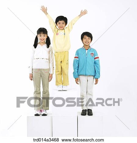 Stock Photo - Child with two arms up for cheering and her friends. Fotosearch