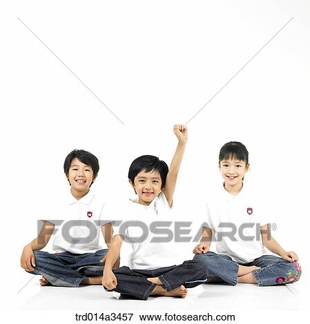 Friends and boy raising hands on the floor View Large Photo Image Stock Photo - Friends and boy raising hands on the floor. Fotosearch