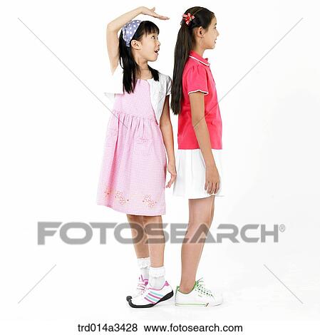 Girl measuring height View Large Photo Image Stock Photo - Girl measuring height. Fotosearch