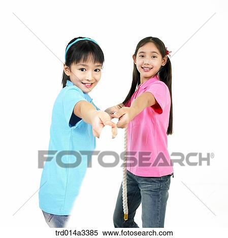 Girls playing at tug of war View Large Photo Image Stock Photography - Girls playing at tug of war . Fotosearch