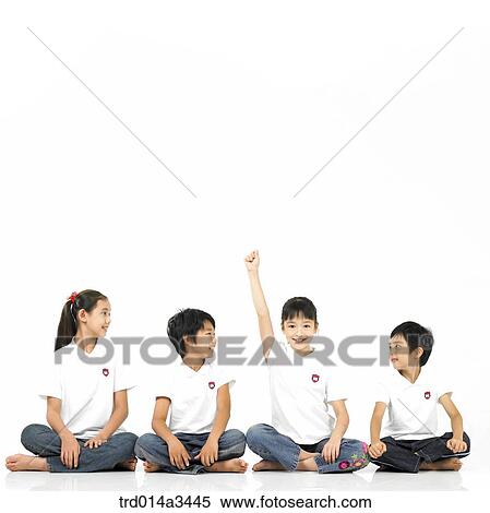 one child raising hand and others are looking at him View Large Photo Image Stock Photography - one child raising hand and others are looking at him. Fotosearch