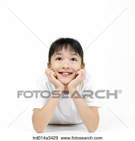 Thinking girl lying prone View Large Photo Image Stock Photo - Thinking girl lying prone. Fotosearch