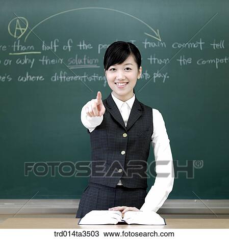 Girl poingitng front in the classroom View Large Photo Image Stock Image - Girl poingitng front in the classroom. Fotosearch