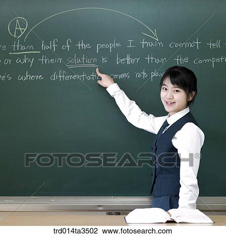 Girl pointing at English word on the blackboard View Large Photo Image Stock Image - Girl pointing at English word on the blackboard. Fotosearch