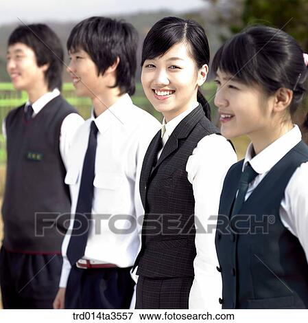 Smiling students standing a row View Large Photo Image Stock Photo - Smiling students standing a row. Fotosearch
