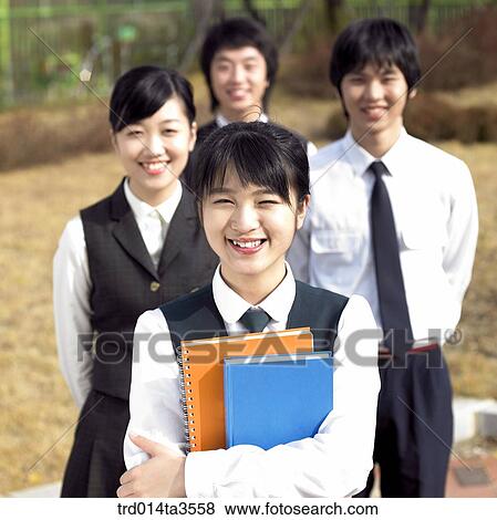 Smiling students standing a row View Large Photo Image Stock Photo - Smiling students standing a row. Fotosearch
