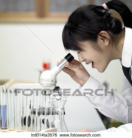 student looking in microscope View Large Photo Image Stock Photograph - student looking in microscope. Fotosearch
