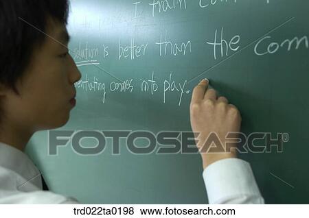 Student writing on the blackboard View Large Photo Image Stock Photo - Student writing on the blackboard. Fotosearch