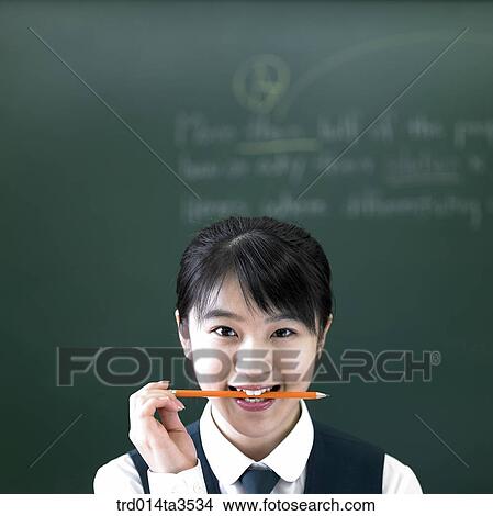 Students biting pencil while sitting View Large Photo Image Picture - Students biting pencil while sitting. Fotosearch