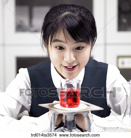 students in uniform doing chemistry experiment View Large Photo Image Picture - students in uniform doing chemistry experiment. Fotosearch