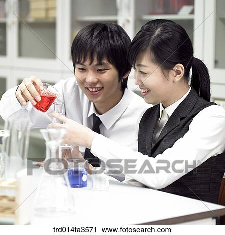 students in uniform doing chemistry experiment View Large Photo Image Stock Image - students in uniform doing chemistry experiment. Fotosearch