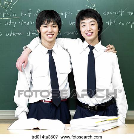 Students in uniform putting their arms on other's shoulder View Large Photo Image Stock Photo - Students in uniform putting their arms on other's shoulder. Fotosearch