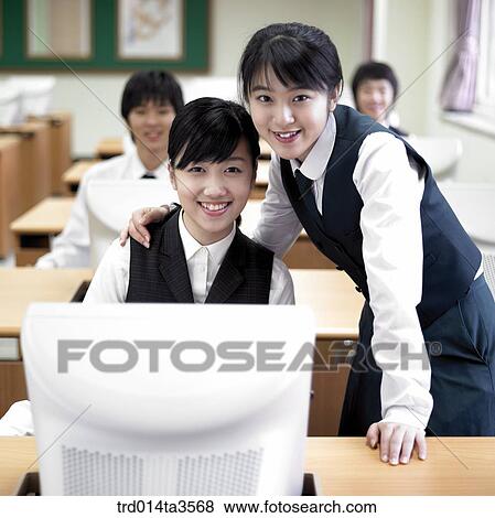 students in uniform taking class in the classroom View Large Photo Image Stock Photo - students in uniform taking class in the classroom. Fotosearch