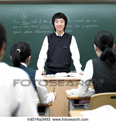 Students in uniform taking English class in the classroom View Large Photo Image Stock Image - Students in uniform taking English class in the classroom. Fotosearch